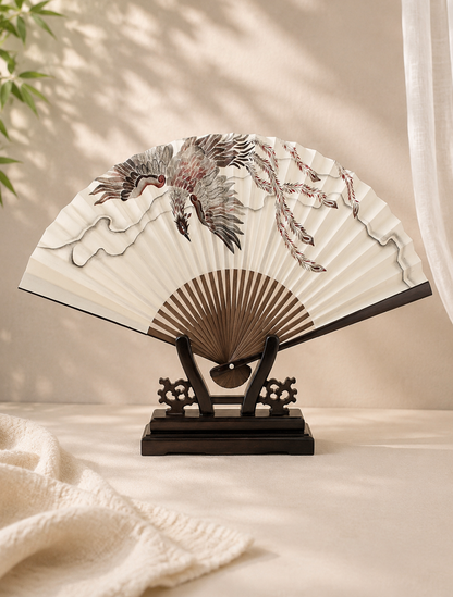 Decorative fan with artistic design displayed on a hard wood stand 