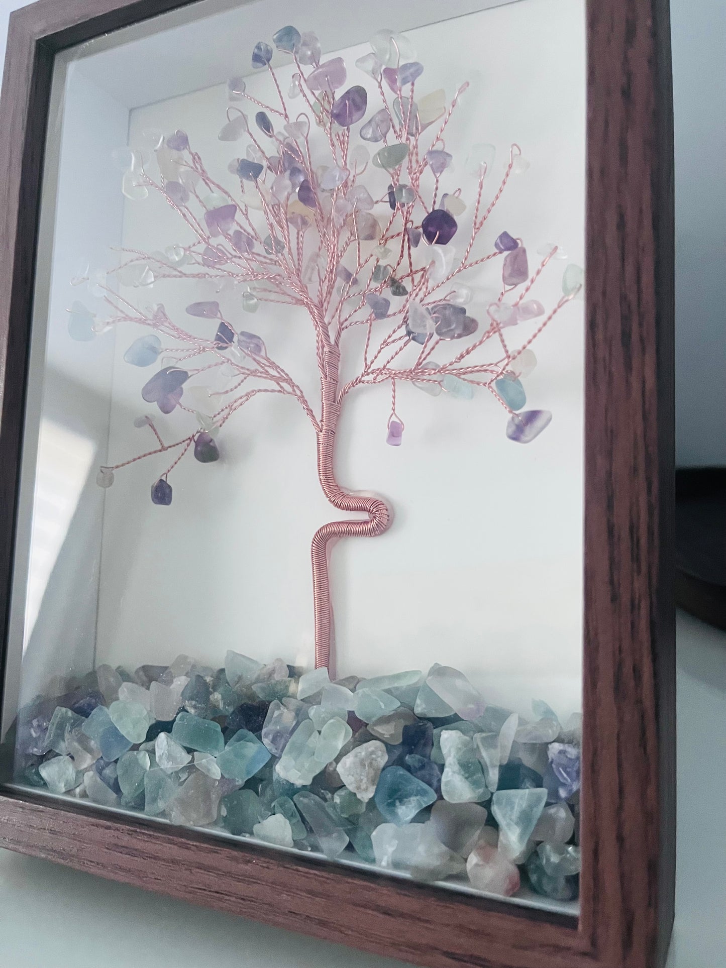 a framed natural crystal tree hand crafted with mix crystals